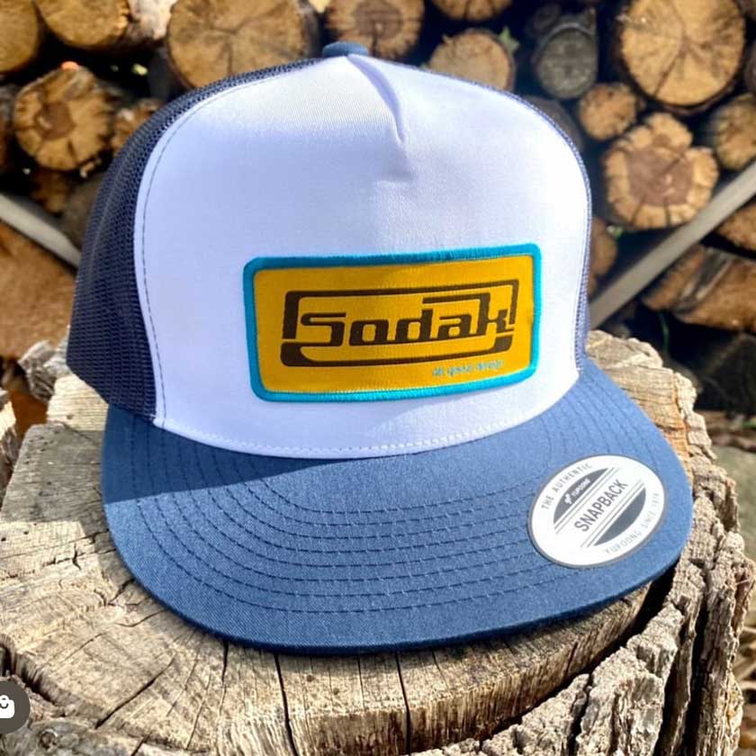 This new SoDak Classic flatbill hat is inspired by old school car hood ornaments! Show your love for South Dakota with one of these fun retro snapback flat bill hats.
