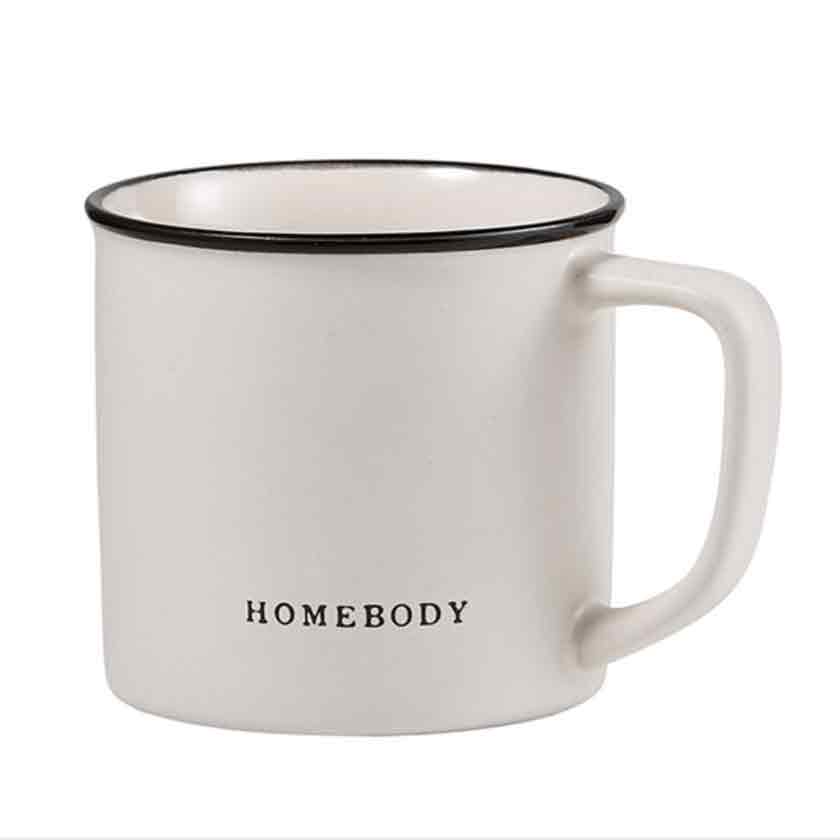 Ceramic coffee mug inscribed with the words Homebody