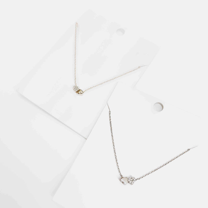 Necklace with a small round pendant on a white background