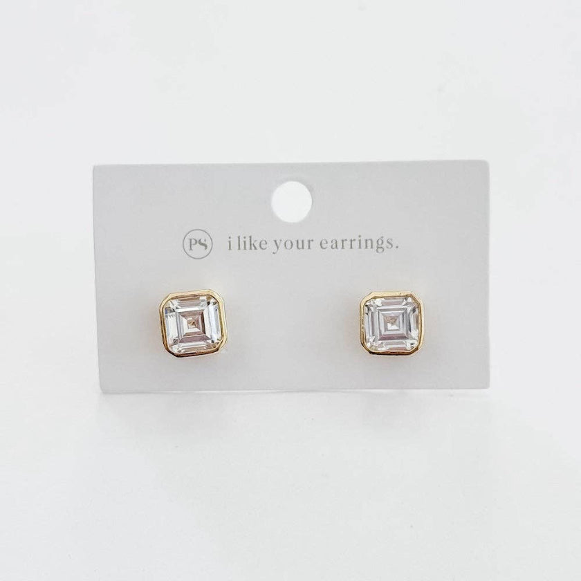 Gold square stud earrings on a 'I like your earrings' card against a white background