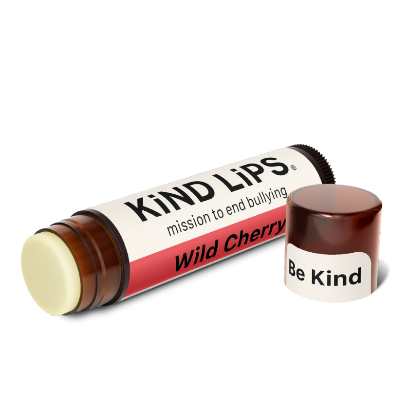 Lip balm with 'Kind Lips' packaging on a white background