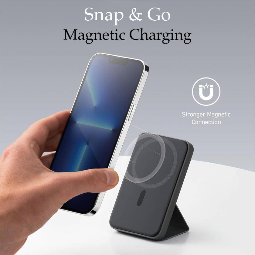 Magnetic charging device with smartphone on a gray background