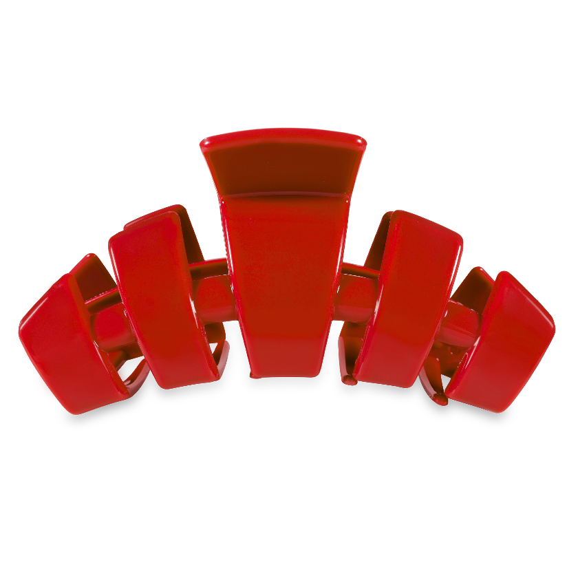 Red hair clip on a white background