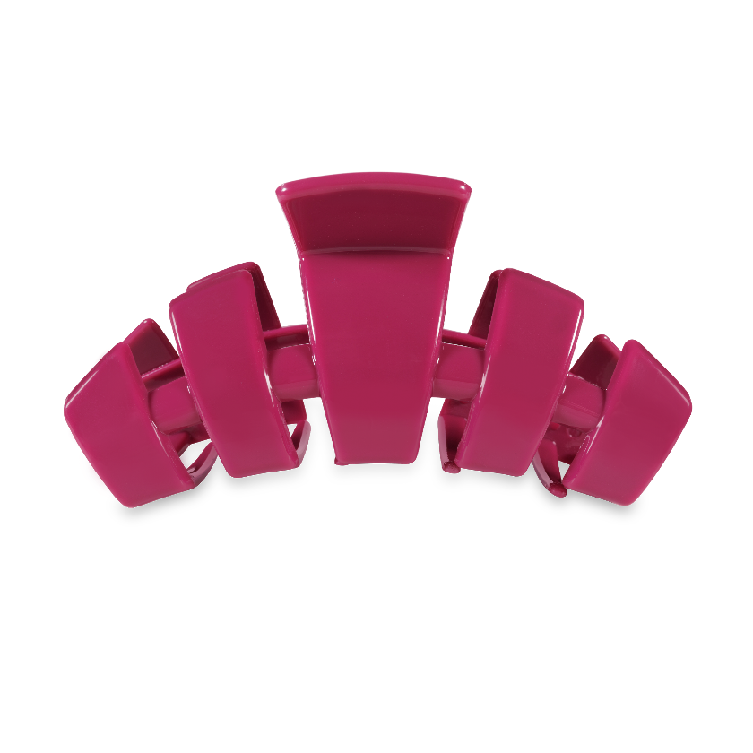 Pink hair clip on a white background