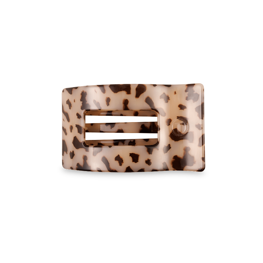 Leopard print hair clip on a white background