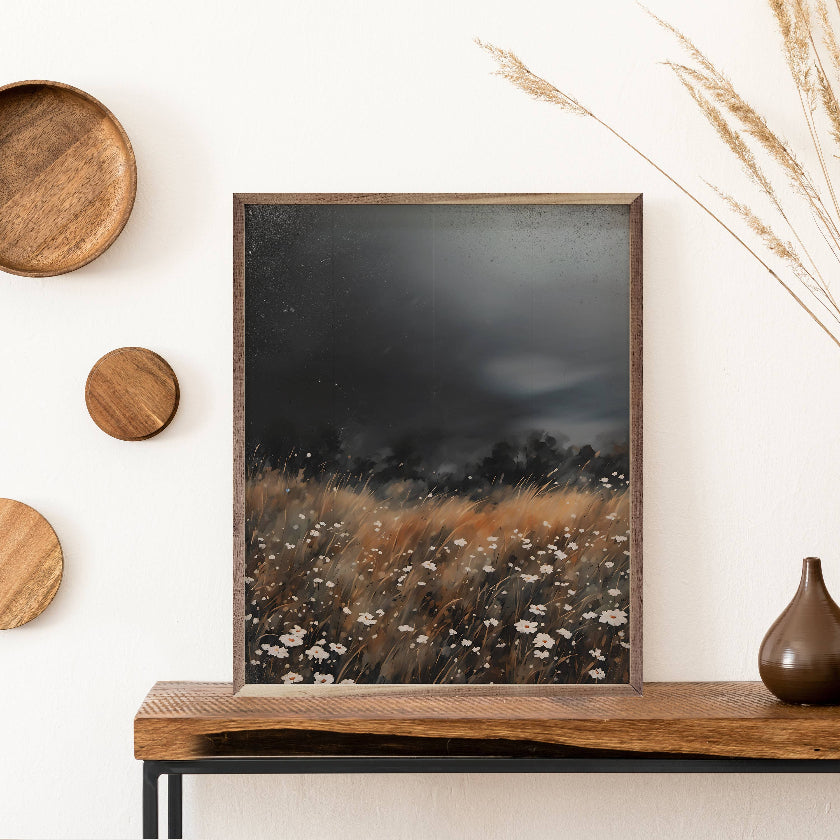 Framed artwork of a natural landscape on a wooden shelf with decorative elements.