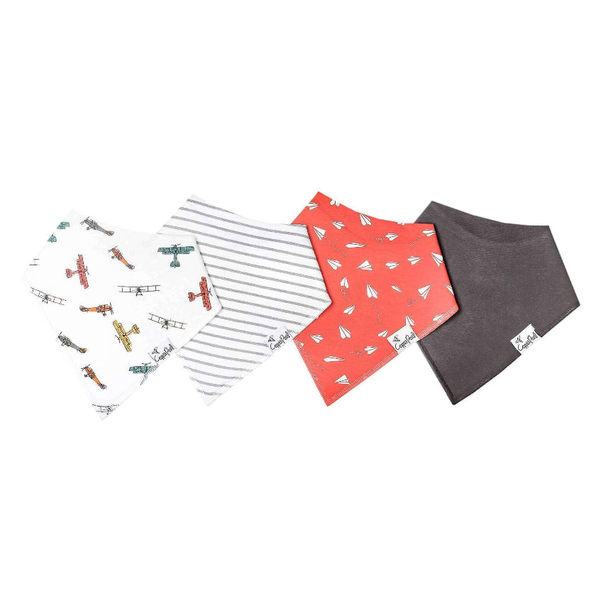 Four baby bibs with different patterns on a white background