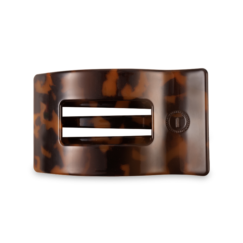 Tortoiseshell belt buckle on a white background