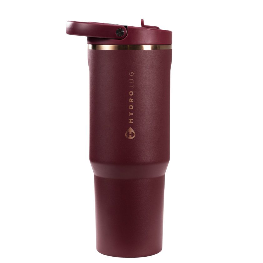 Maroon travel mug with rose gold lid on a white background