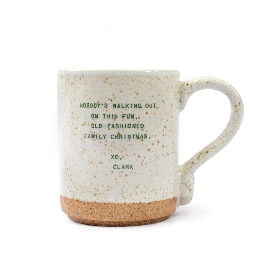 Speckled mug with text on a white background