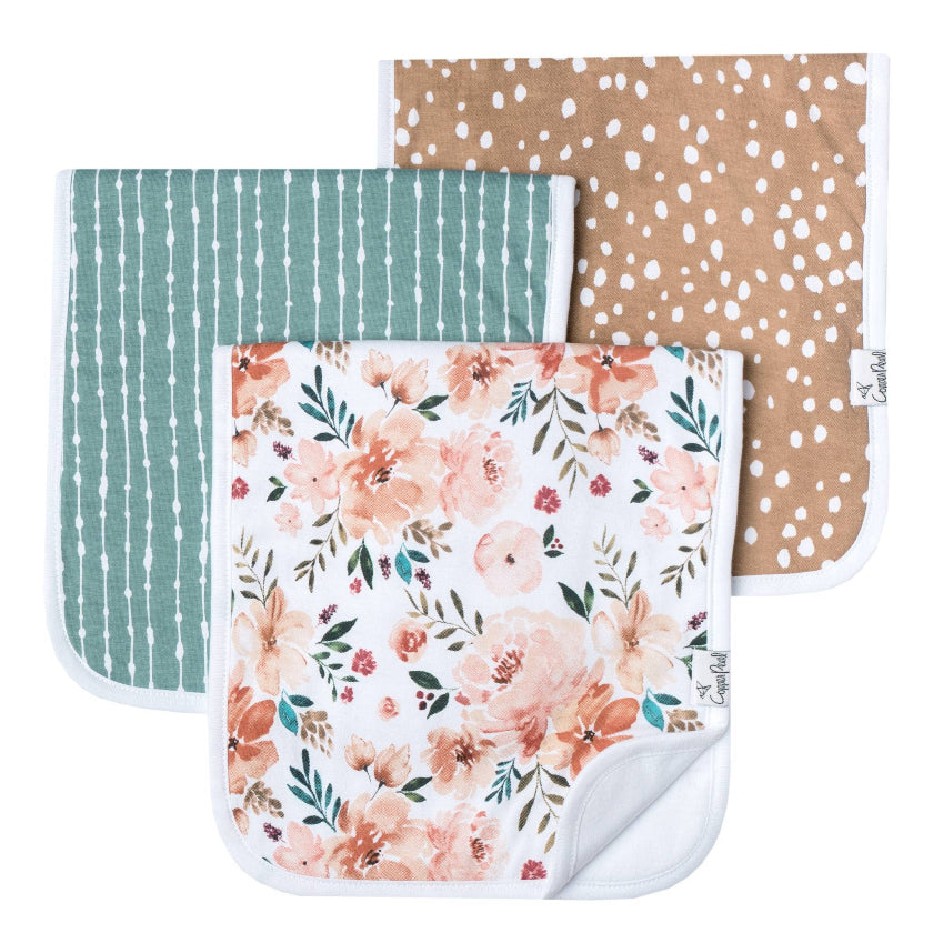 Three baby blankets with different patterns on a white background
