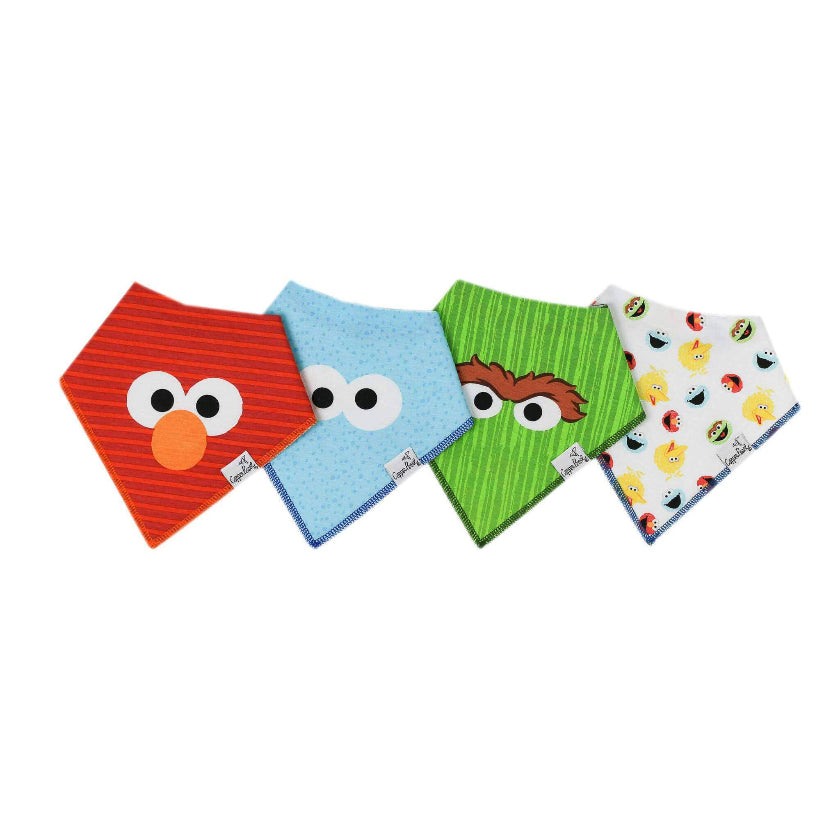 Four colorful baby bibs with cartoon designs on a white background