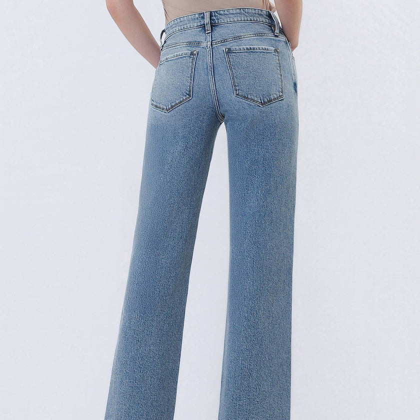 Light blue jeans worn by a person on a white background