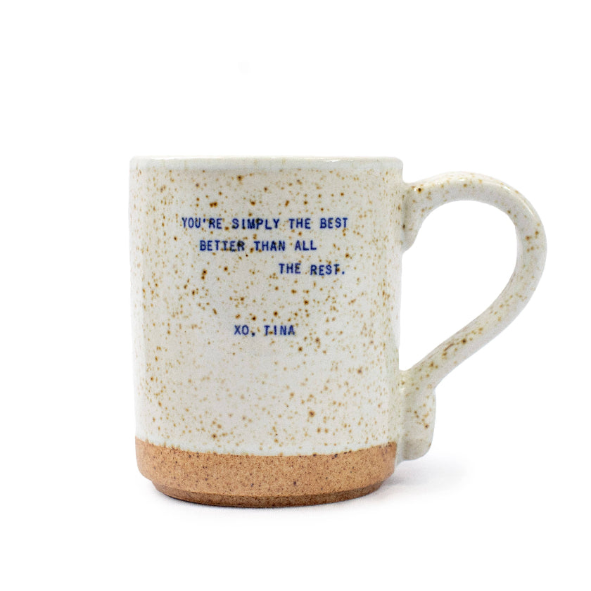 Speckled mug with text on a white background