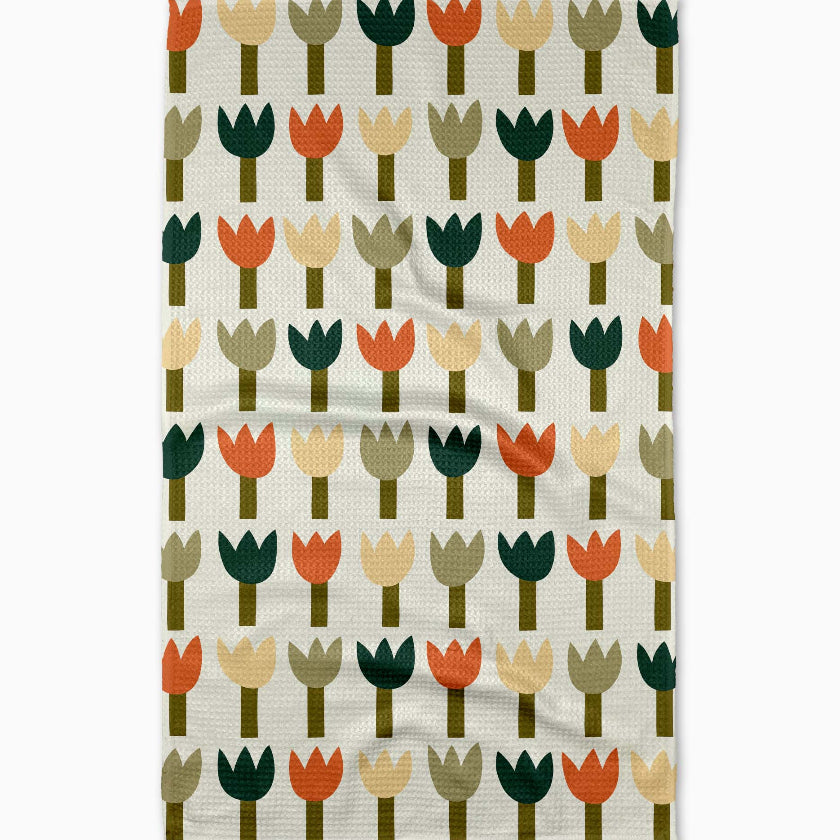 Patterned towel with colorful tulip design on a white background