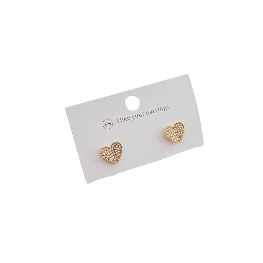 Heart-shaped gold earrings on a white card with text