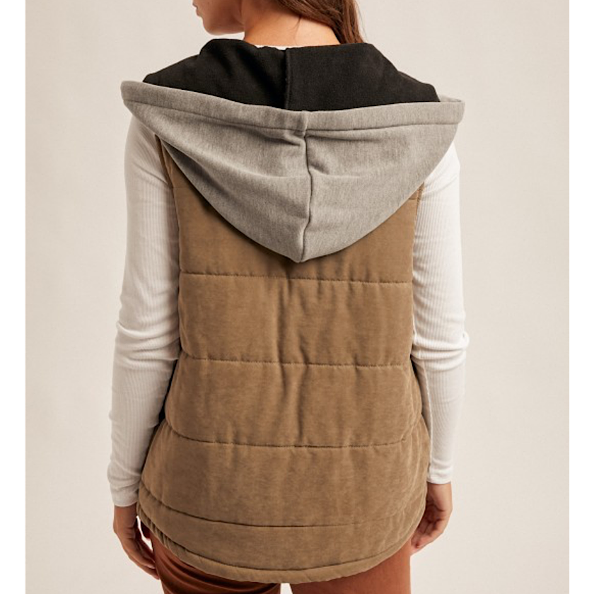 Brown puffer vest with gray hood worn by a person on a plain background