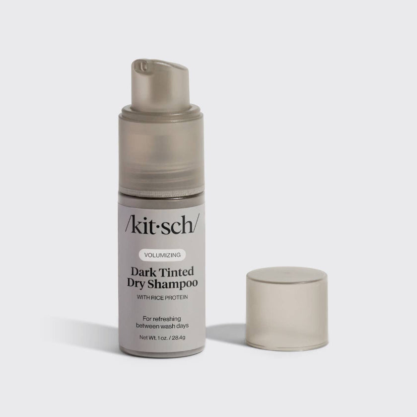 Kitsch dark tinted dry shampoo bottle on a light gray background