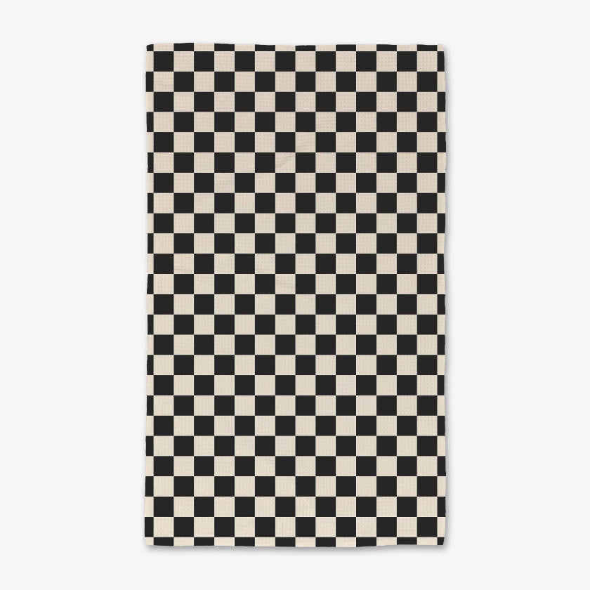 Checkered black and white rug on a white background