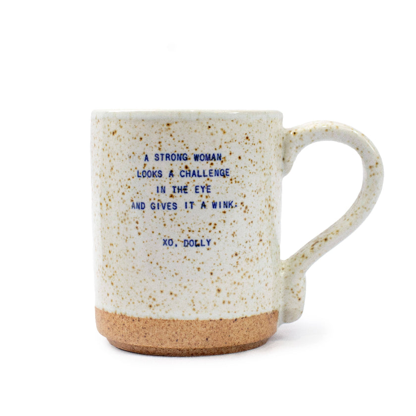 Speckled mug with a motivational quote on a white background