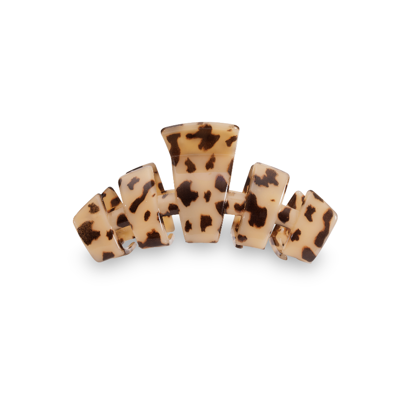 Leopard print hair clip on a white background