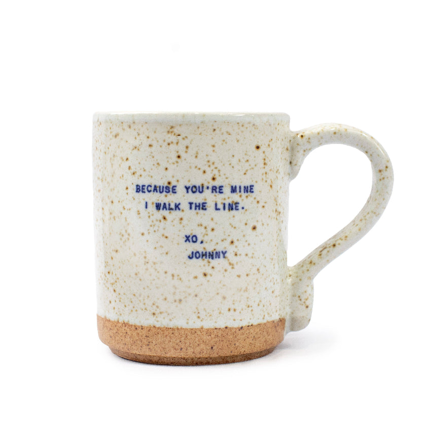 Speckled mug with text on a white background