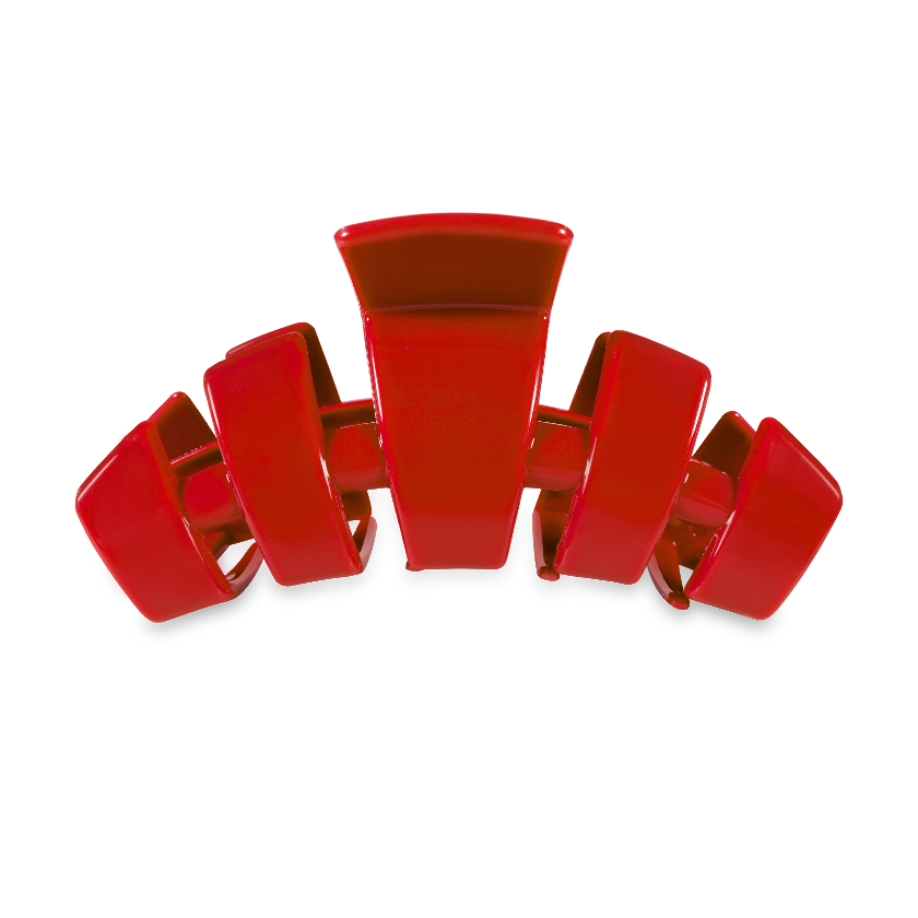 Red hair clip on a white background