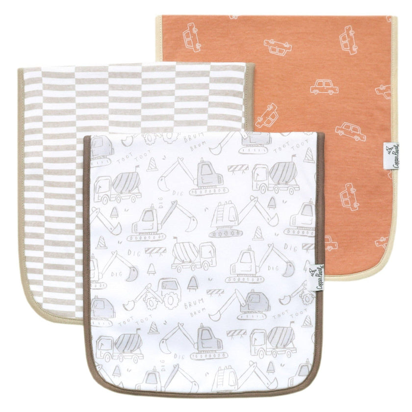 Three baby burp cloths with different patterns on a white background