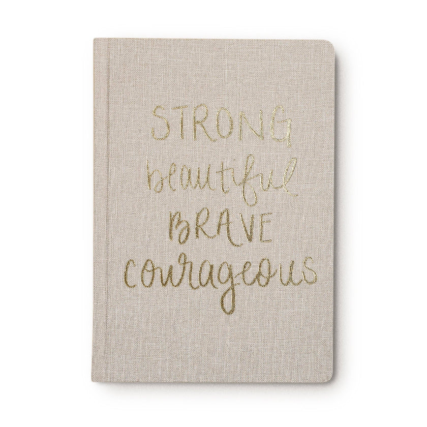 Beige notebook with gold text on a white background