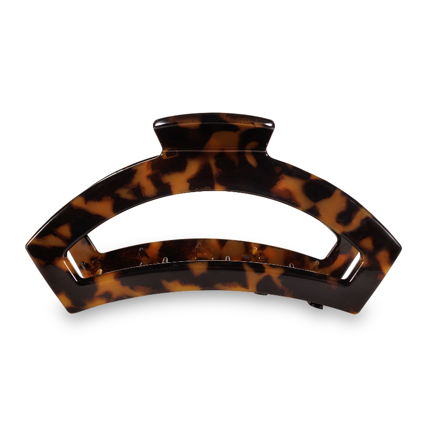 Tortoiseshell patterned hair clip on a white background