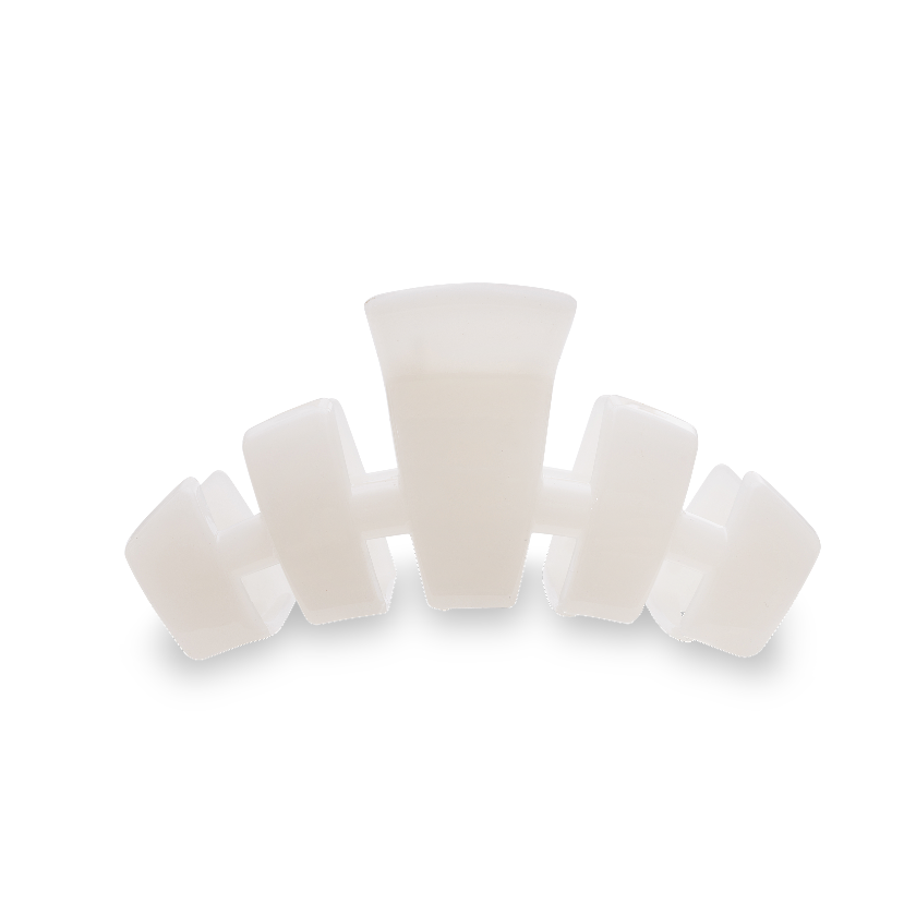 Set of white silicone cups on a white background