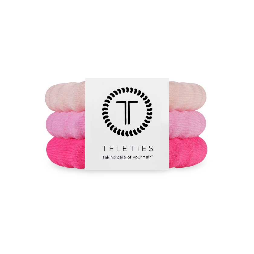 Set of pink hair ties with Teleties brand label on a white background
