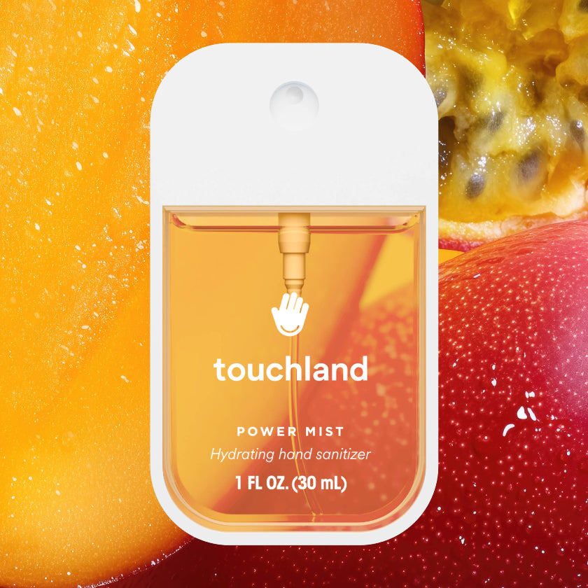 Touchland power mist hand sanitizer packaging with a fruit background