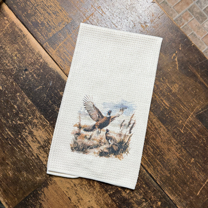 Decorative towel with a wolf design on a wooden surface