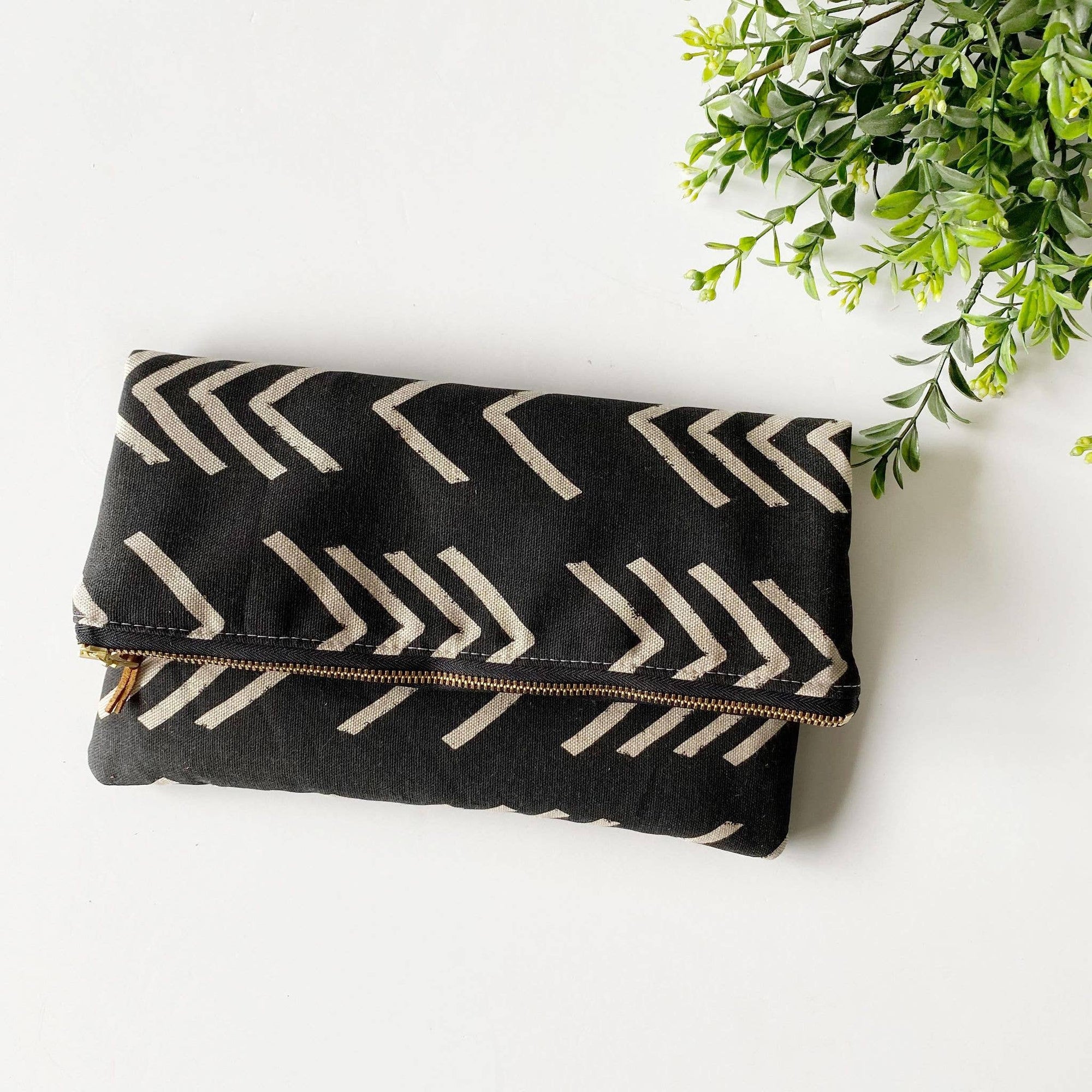 Large foldover clutch in black and cream arrow