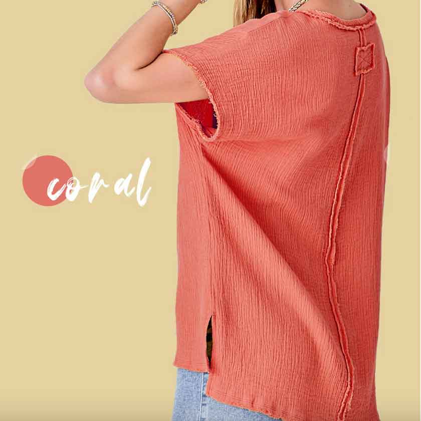 V-neck cotton gauze top in coral with raw edge details and side slits at the bottom and high-low bottom hem.
100% COTTON