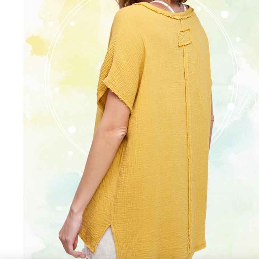 V-neck cotton gauze, in dry mustard, top with raw edge details and side slits at the bottom and high-low bottom hem.
100% COTTON