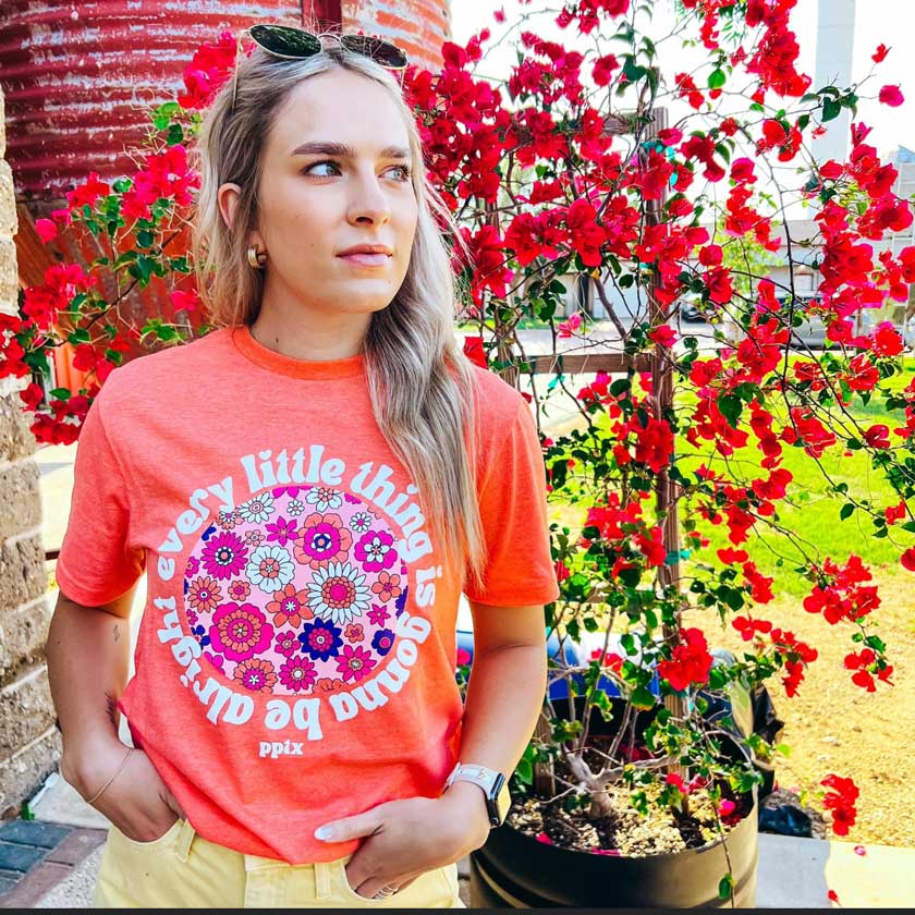 "Every little thing is gonna be alright!" graphic Tee shirt. Printed on the most gorgeous Heather Orange tee, with vibrant poles of color! Unisex.