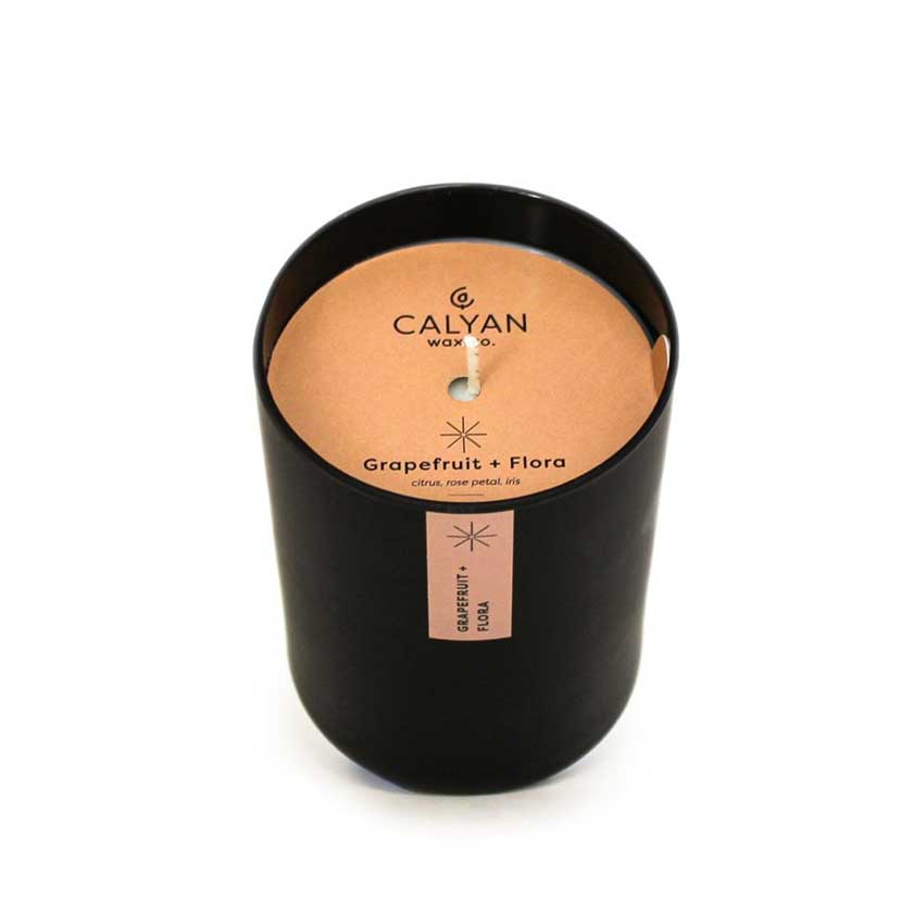 Grapefruit + Flora Matte Black Tumbler Candle by Calyan Wax.
