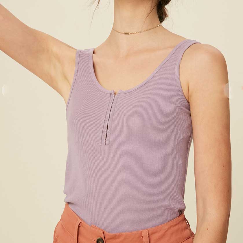A lavendar, ribbed, hook and eye closure henley tank top with a scoop neckline.