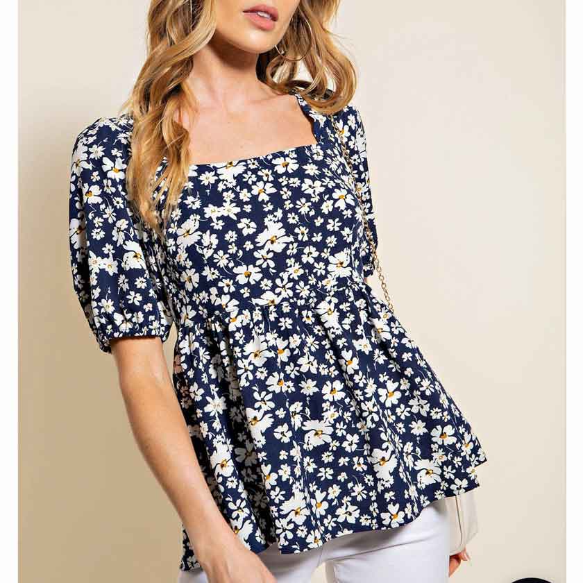 Navy, floral, smocked baby doll top. Soft texture. Daisy print. Puff sleeves. Ties in the back.