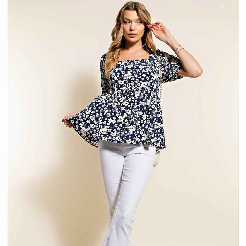 Navy, floral, smocked baby doll top. Soft texture. Daisy print. Puff sleeves. Ties in the back.
