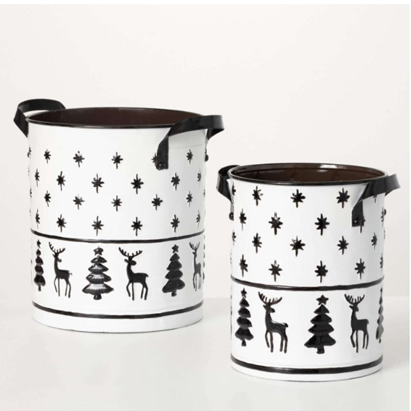 Festive & fun for sensible seasonal storage, this pair of metal containers will look striking all winter long. Finished in a glazed snow-white hue accented with cool gray artwork, this set stands 10.5" & 12.25" tall, featuring embossed deer, trees & snowflakes.  Dimensions:
13"L x10"W x12.5"
9.5"L x8.5"W x10.5"