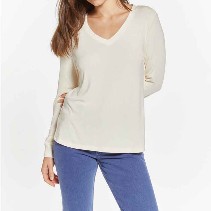 V-neck top in Ivory with cuffed sleeves.