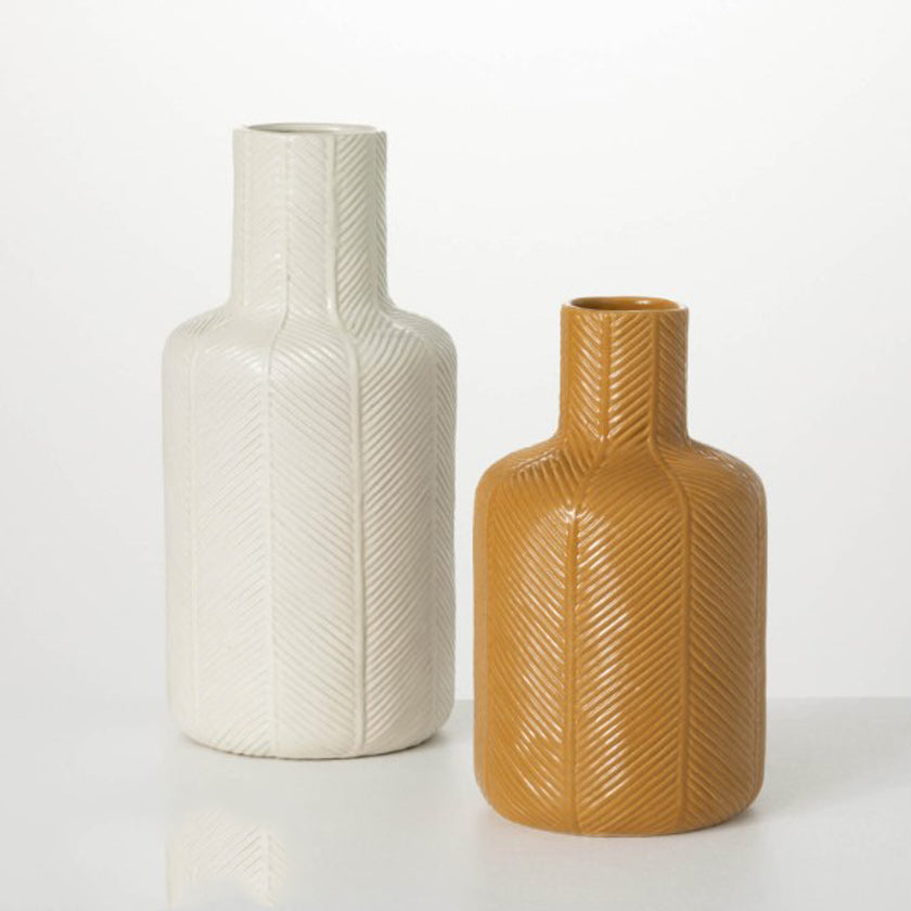 Shapely and statuesque, this pair of delightfully-designed white ceramic vases will look amazing filled with your favorite faux-dried stem.